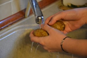 Manage your kitchen's moisture when rinsing food and washing dishes