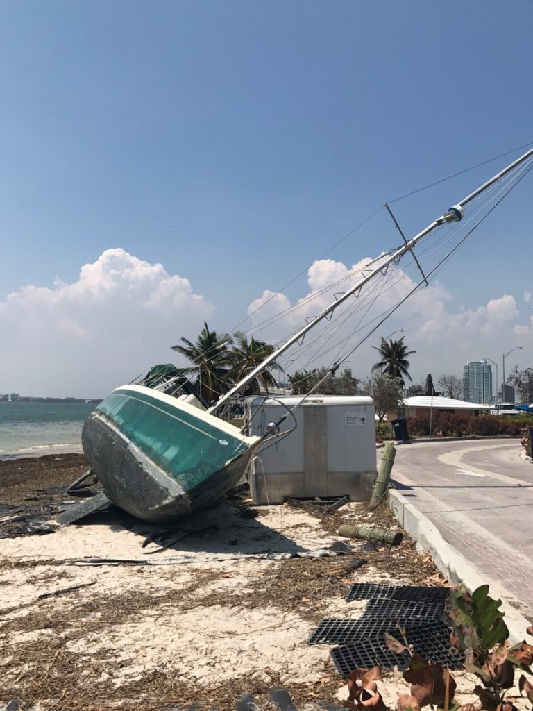 INTEK's Jenna Snyder snaps a photo of a washed-up sailboat after the hurricane.
