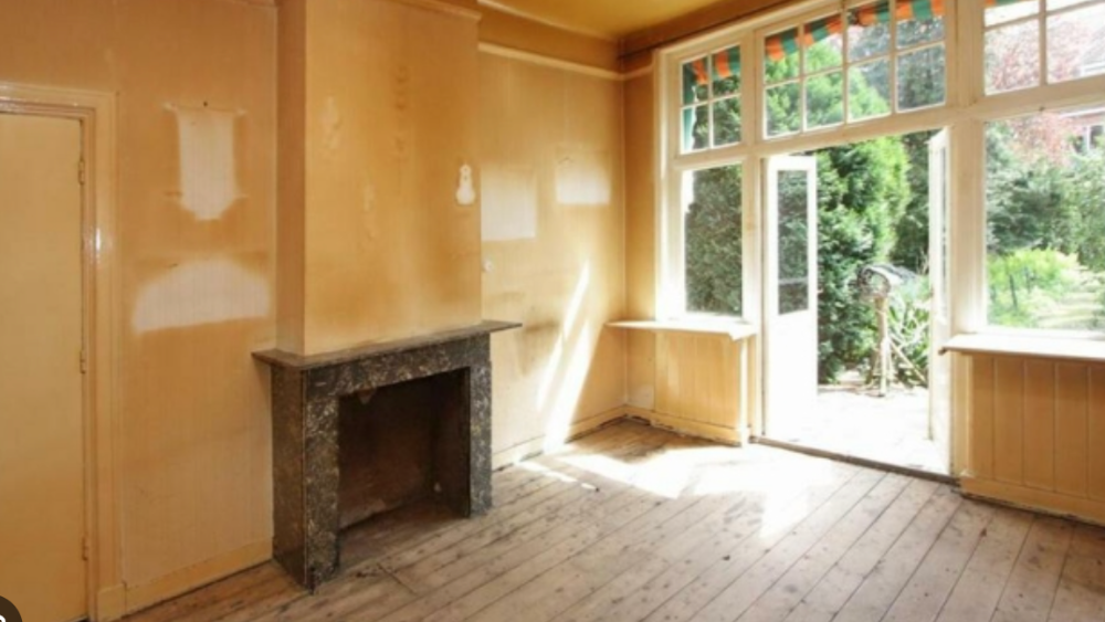 Before photo of a family room from a home restoration job.