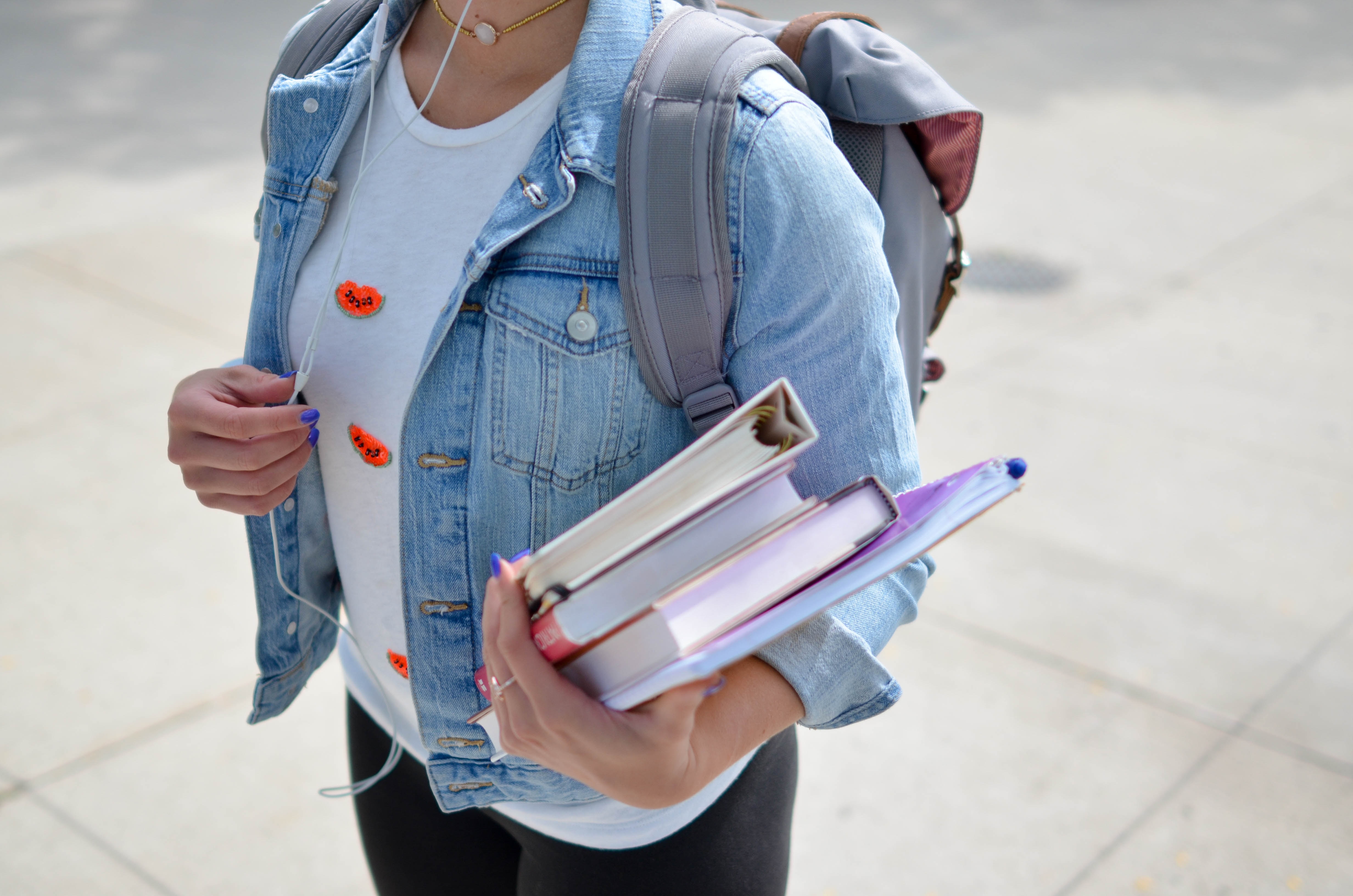 Girl with books and backpack