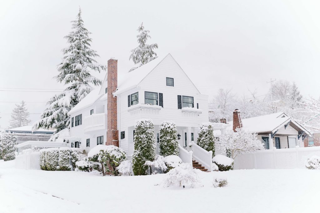 large home covered in snow